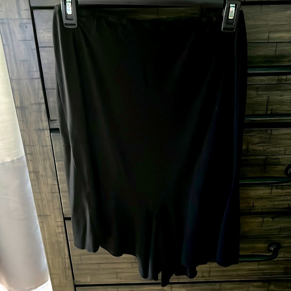 Black mid length flows skirt. Size small.